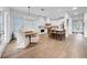 Bright eat-in kitchen featuring white cabinets, wood accents, island seating and stainless appliances at 422 Islebay Dr, Apollo Beach, FL 33572