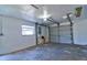 A well-lit garage provides ample space for parking and storage, featuring a sturdy gray door and bright lighting at 510 55Th Ne Ave, St Petersburg, FL 33703