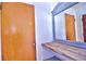 Hallway with a wood countertop, vanity, and mirror, next to a wooden door at 510 55Th Ne Ave, St Petersburg, FL 33703