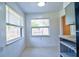 Cozy breakfast nook bathed in natural light from large windows, offering a perfect spot for morning coffee at 510 55Th Ne Ave, St Petersburg, FL 33703