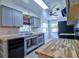 Bright kitchen featuring sleek countertops, modern appliances, and ample cabinet space for storage at 510 55Th Ne Ave, St Petersburg, FL 33703