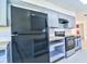 Modern kitchen showcasing stainless steel appliances, sleek countertops, and ample storage space at 510 55Th Ne Ave, St Petersburg, FL 33703