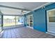 Covered patio features a ceiling fan, tiled floor and blue exterior wall offering a relaxing outdoor space at 510 55Th Ne Ave, St Petersburg, FL 33703