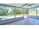 Screened patio boasts lush backyard views, offering a serene space for relaxation and outdoor enjoyment at 510 55Th Ne Ave, St Petersburg, FL 33703