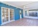 An outdoor patio featuring tile flooring and a ceiling fan provides a comfortable space for relaxation and entertaining at 510 55Th Ne Ave, St Petersburg, FL 33703
