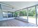 Enclosed patio with tile floor and ceiling fan perfect for outdoor enjoyment and relaxation year-round at 510 55Th Ne Ave, St Petersburg, FL 33703