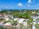 Stunning aerial view showcasing a waterfront property with a private pool, lush greenery, and picturesque ocean views at 5430 Avenida Del Mare, Sarasota, FL 34242