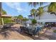 A beautiful backyard oasis with a sparkling pool, comfortable seating, and lush landscaping, perfect for relaxation and enjoyment at 5430 Avenida Del Mare, Sarasota, FL 34242
