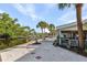 A waterfront home features a lovely outdoor patio with a beautiful waterfront view and lush tropical landscaping at 5430 Avenida Del Mare, Sarasota, FL 34242
