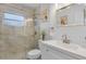Nicely renovated bathroom featuring a tiled shower with glass doors, and white vanity at 5430 Avenida Del Mare, Sarasota, FL 34242