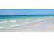 A relaxing view of a beach with clear water and a serene shoreline at 5430 Avenida Del Mare, Sarasota, FL 34242