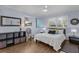 Cozy bedroom featuring two bright windows, sleek tile floors and calming, neutral tones at 5430 Avenida Del Mare, Sarasota, FL 34242