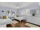 Bright bedroom with twin beds, dresser, and windows with blinds at 5430 Avenida Del Mare, Sarasota, FL 34242
