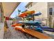 Exterior home view with kayak storage under a covered patio at 5430 Avenida Del Mare, Sarasota, FL 34242