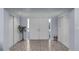 Spacious foyer featuring double doors, tile flooring, and ample closet space for storage at 5430 Avenida Del Mare, Sarasota, FL 34242