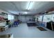 Spacious garage featuring ample storage, a ping pong table, and room for multiple bikes at 5430 Avenida Del Mare, Sarasota, FL 34242