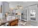 Updated kitchen featuring stainless steel appliances, white cabinetry, and breakfast bar seating at 5430 Avenida Del Mare, Sarasota, FL 34242