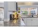 Charming kitchen featuring granite countertops, ample cabinetry, and natural light at 5430 Avenida Del Mare, Sarasota, FL 34242