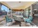 Comfortable lanai with cushioned seating, a view of the canal, and beautiful outdoor living at 5430 Avenida Del Mare, Sarasota, FL 34242
