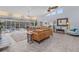 Spacious living room with high ceilings, tile floors, and comfortable seating at 5430 Avenida Del Mare, Sarasota, FL 34242