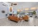 Spacious living room with a fireplace, modern lighting, and sliding glass doors to the outdoor space at 5430 Avenida Del Mare, Sarasota, FL 34242