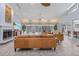 Spacious living room with tile flooring, fireplace, ceiling fan and sliding glass doors to outdoor living area at 5430 Avenida Del Mare, Sarasota, FL 34242
