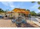 Outdoor patio with brick pavers, dining and seating areas, perfect for entertaining or enjoying a relaxing waterfront view at 5430 Avenida Del Mare, Sarasota, FL 34242