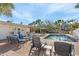 Resort-style living with this private pool surrounded by lush palms and comfortable outdoor seating at 5430 Avenida Del Mare, Sarasota, FL 34242