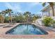 Inviting backyard pool surrounded by lush tropical landscaping and beautiful brick pavers at 5430 Avenida Del Mare, Sarasota, FL 34242
