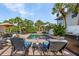 Relaxing backyard pool with lounge chairs and lush tropical landscaping at 5430 Avenida Del Mare, Sarasota, FL 34242