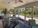 Enclosed porch with seating and views of a serene waterfront at 5430 Avenida Del Mare, Sarasota, FL 34242