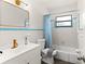 Stylish bathroom with a vanity, toilet, and bathtub, perfect for relaxation at 5619 New York Ave, Sarasota, FL 34231