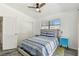 Bright bedroom with a bed, side tables, and natural light from the window at 5619 New York Ave, Sarasota, FL 34231