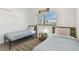 Bedroom with two twin beds, providing a comfortable space for rest and relaxation at 5619 New York Ave, Sarasota, FL 34231