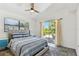 Bright bedroom with a bed, side tables, and natural light from the sliding door at 5619 New York Ave, Sarasota, FL 34231