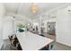 Open floor plan showcasing dining area with view of the modern kitchen and living spaces at 5619 New York Ave, Sarasota, FL 34231