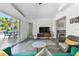 Comfortable living area connects to outdoor patio, creating seamless indoor-outdoor living at 5619 New York Ave, Sarasota, FL 34231