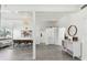 Open-concept living room and dining room with modern decor, and sleek gray flooring at 5619 New York Ave, Sarasota, FL 34231
