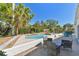 Outdoor patio with outdoor seating and lush landscaping, near a pool for outdoor relaxation at 5619 New York Ave, Sarasota, FL 34231