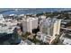 An aerial view shows the condominium's rooftop pool and building facade in an urban setting at 628 Cleveland St # 612, Clearwater, FL 33755