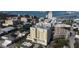 Aerial view shows the high-rise building among others, near water and a bridge at 628 Cleveland St # 612, Clearwater, FL 33755