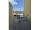 Condo balcony with seating area and views of the city skyline in the distance at 628 Cleveland St # 612, Clearwater, FL 33755
