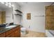 Well-lit bathroom with a granite vanity, tiled floor, and a shower-tub combo at 628 Cleveland St # 612, Clearwater, FL 33755