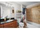 A charming bathroom with granite vanity, stylish tile accents, and a shower-tub combination at 628 Cleveland St # 612, Clearwater, FL 33755