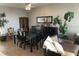 A dining room with tile flooring, table, chairs, and plants at 628 Cleveland St # 612, Clearwater, FL 33755