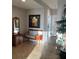 A tiled entryway featuring a mirror, bench, and decor at 628 Cleveland St # 612, Clearwater, FL 33755