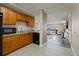 Basement kitchenette featuring granite countertops and stainless steel microwave and dishwasher at 628 Cleveland St # 612, Clearwater, FL 33755
