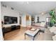 Bright and open living room featuring hardwood floors with access to the dining and kitchen areas at 628 Cleveland St # 612, Clearwater, FL 33755