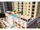 Rooftop pool featuring lounge chairs, pergola, and views at 628 Cleveland St # 612, Clearwater, FL 33755