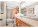 Neutral colored bathroom with a shower-tub combination and wood vanity at 6497 Cape Hatteras Ne Way # 3, St Petersburg, FL 33702